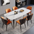 six orange butterfly chairs with one white four legs rectangle dining table